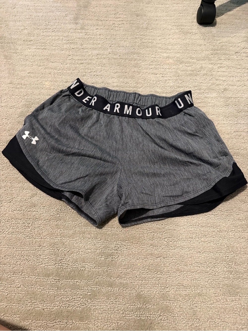 Gray and black cloth under Armour shorts